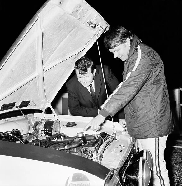 Sport - Motor. Rally racing. Sgt. Wally Eastern, is shown the Engine of Roger Clark