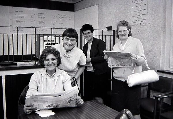 Four sporting ladies smiling after placing winning bets at a Ladies only betting shop in