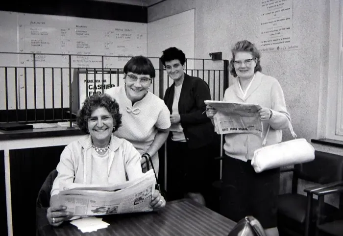 Framed Print : Four sporting ladies smiling after placing winning bets at a Ladies only betting shop in Framed Print : Four sporting ladies smiling after placing winning bets at a Ladies only betting shop in
