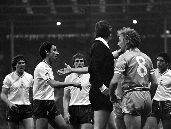 Spurs players argue with the referee l-r Steve Perryman, Ossie Ardiles