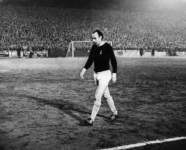 Spurs Scotish international, Alan Gilzean, leaves the pitch after being given his