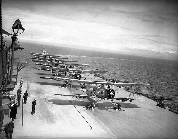 Squadron of Fairey Swordfish planes on board HMS Ark Royal prepare to launch from