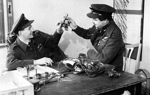 Squadron Leader H. R. Leven and his navigator M. Nolan who have flown in 78 operations as