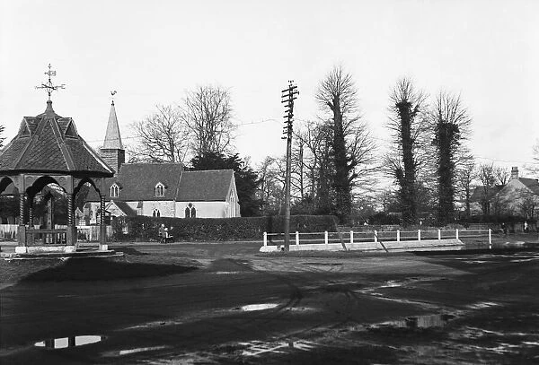 St Giles church at Ickenham, London, in the fore ground is the village pump Circa 1930