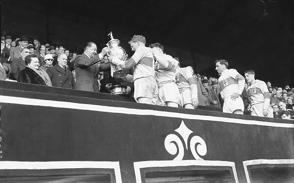St Helens are presented with the trophy after their 13 - 2 victory over Halifax in