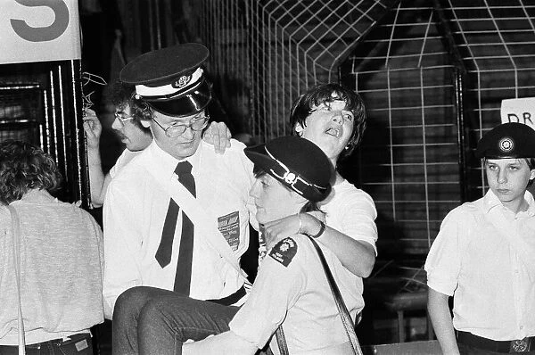 St John Ambulance Volunteers carrying a fan at a Duran Duran concert