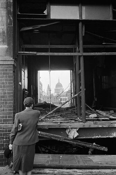 St Pauls Cathedral seen through a blasted shop on Fetter Lane. 4th August 1944