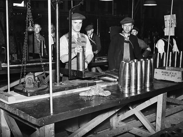 Stacking shells for anti-aircraft guns in a midland shell factory. 4th October 1939