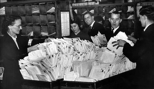 Staff sorting mail at Christmas time. Merseyside. 20th December 1955
