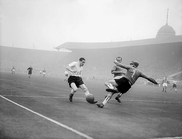 Stan Mortensen scoring a goal for England in the first ever match against a Rest of