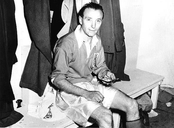Stanley Matthews football shows his winners medal after FA Cup Blackpool v Bolton 1953
