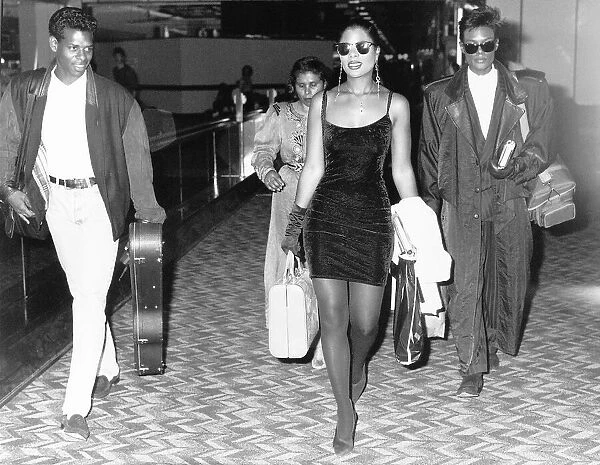 Five Star pop group walk through airport c. 1986
