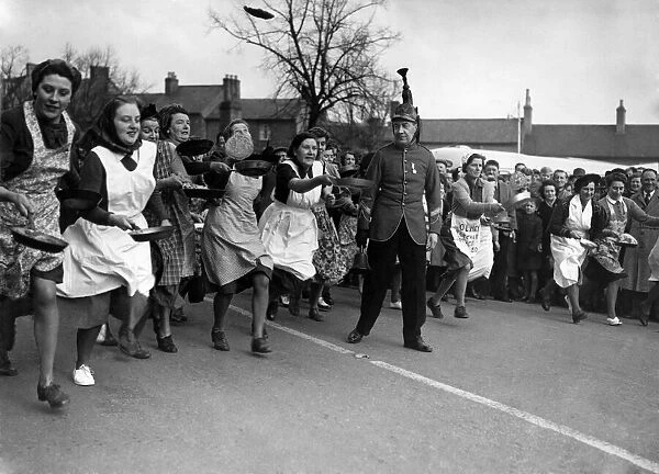 The start of the pancake race in the market square at Olney