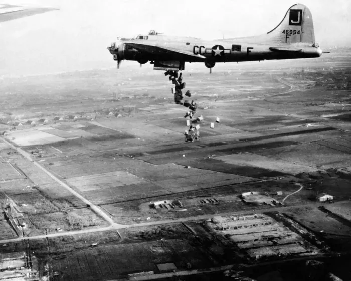 Framed Print : Starving Dutch population bombed with food -- streaming from the bomb bay of a Framed Print : Starving Dutch population bombed with food -- streaming from the bomb bay of a