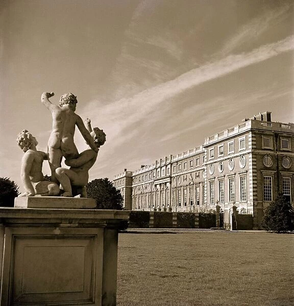 A statue outside an english stately home circa 1950s