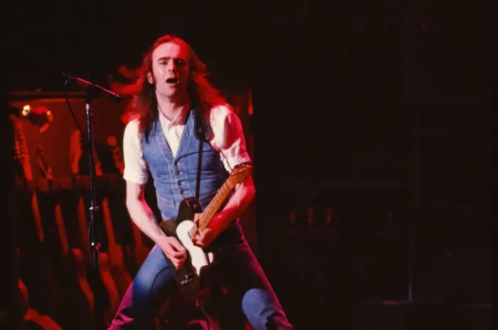 Framed Print : Status Quo, English rock band, onstage in 1981. Picture shows lead singer