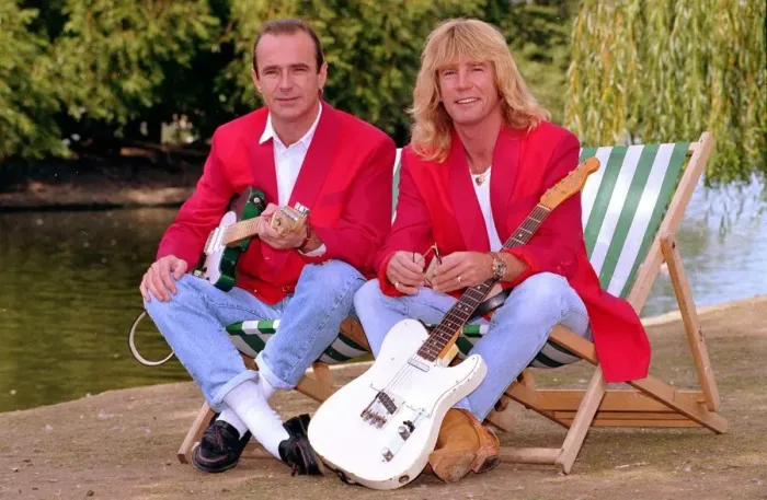 Framed Print : Status Quo wearing red coats at Butlins holiday camp. September 1990 1990s