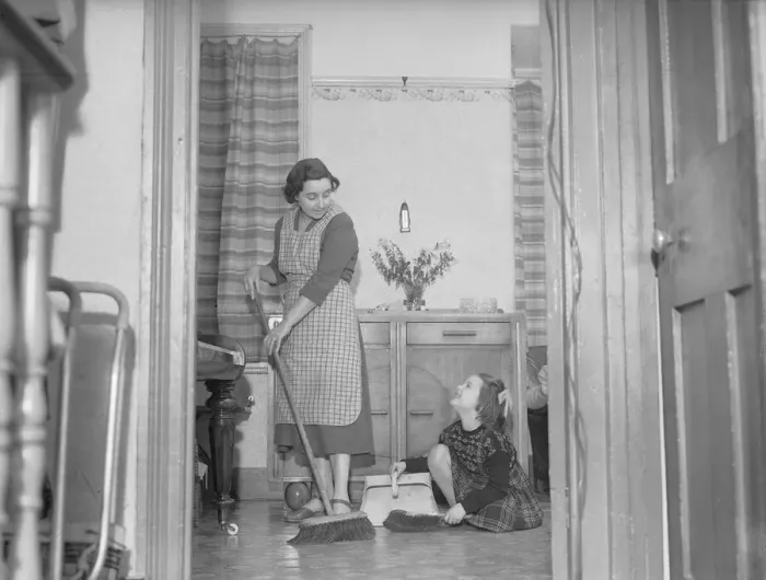 Framed Print : Stay at home mother Mrs Mary Mackenzie seen here bing helped in her household chores by Framed Print : Stay at home mother Mrs Mary Mackenzie seen here bing helped in her household chores by