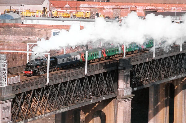 Steam locomotive 44767 George Stephenson leaves Newcastle over the Kinge George Bridge