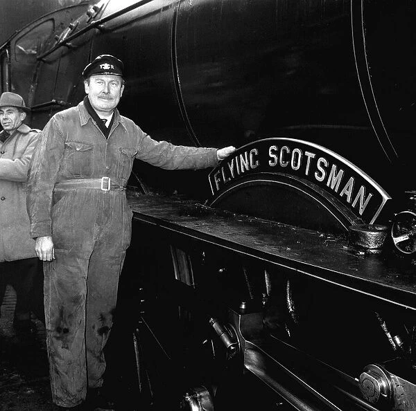 Steam train Flying Scotsman with owner Alan Pegler seen here standing beside the name