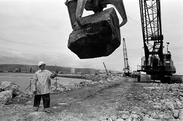 Steel Company of Wales worker David Pinch, 20 directs a huge American crane
