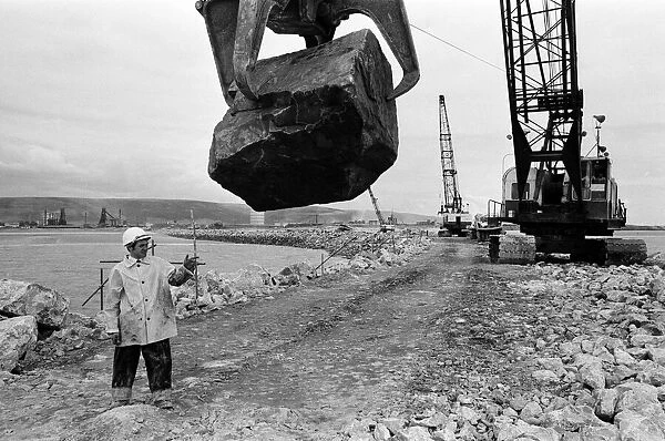 Steel Company of Wales worker David Pinch, 20 directs a huge American crane