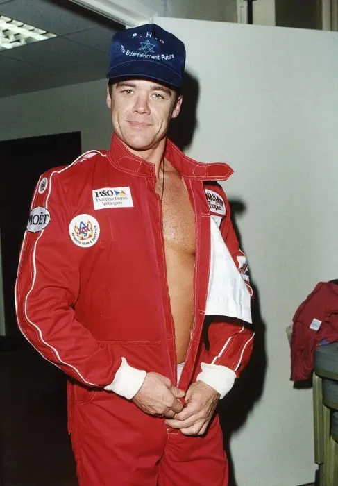Framed Print : Stefan Dennis Actor undressing motor racing overall Framed Print : Stefan Dennis Actor undressing motor racing overall