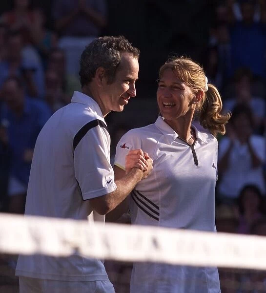 Steffi Graf and John McEnroe celebrate victory July 1999in the Mixed Doubles at Wimbledon