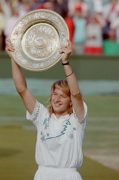 Steffi Graf pictured with her trophy, the Venus Rosewater Dish