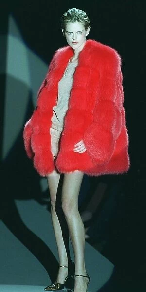 Stella Tennant models a red fur coat and a skimpy dress under it