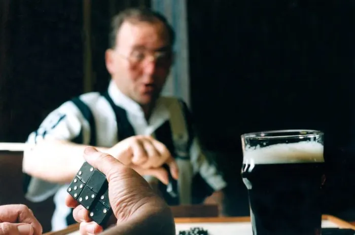 Framed Print : Stephen Harrison plays dominoes at his local club Framed Print : Stephen Harrison plays dominoes at his local club