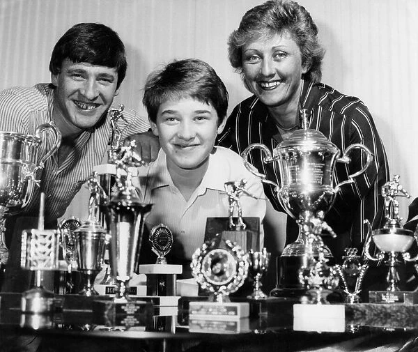Stephen Hendry and his proud parents pose with just some of his glittering collection of