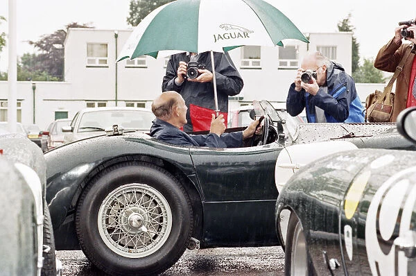 Sterling Moss in a C-Type Jaguar which he piloted to Le Mans 40 years ago