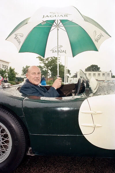 Sterling Moss in a C-Type Jaguar which he piloted to Le Mans 40 years ago