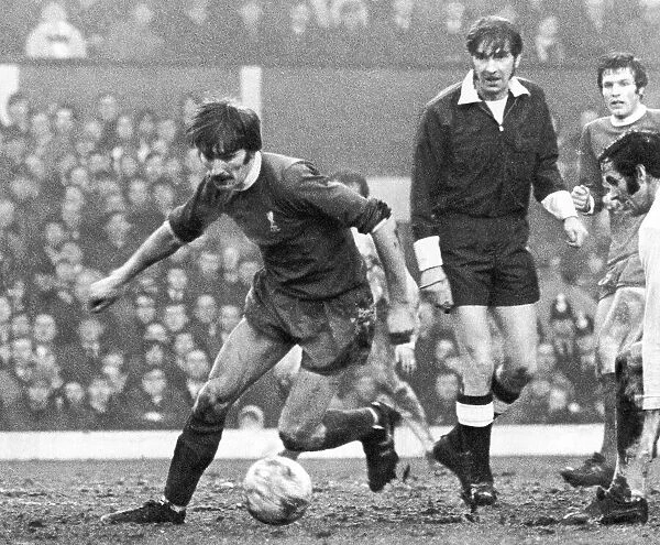 Steve Heighway of Liverpool takes on the Arsenal defence 1971 during match at Anfield