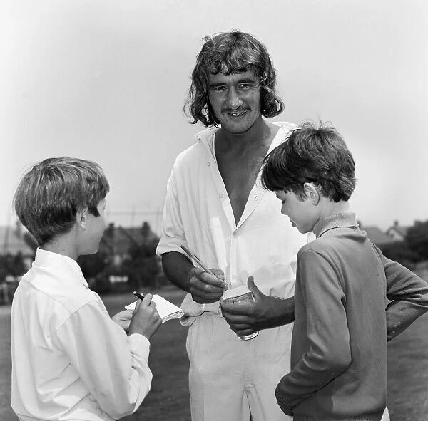 Steve Kember of Crystal Palace signs autographs before taking part in cricket match