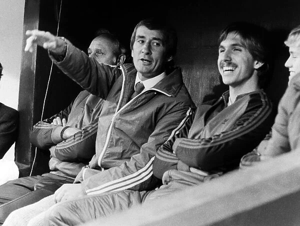 Steve Kember, new manager of Crystal Palace, watches his side from the dugout