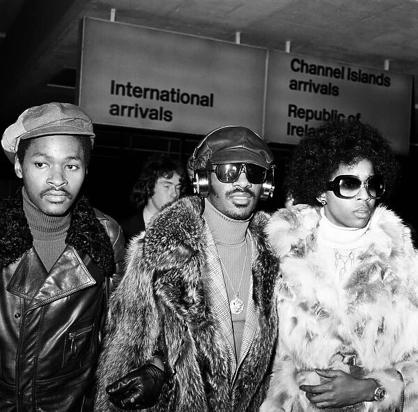 Stevie Wonder arriving at London Airport with Yvonne Wright. 24th January 1974