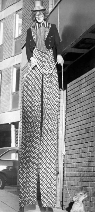 Framed Print : Stilt walker Roy Moore taking a lion cub for a walk in Newcastle Framed Print : Stilt walker Roy Moore taking a lion cub for a walk in Newcastle