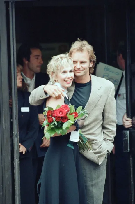 Framed Print : Sting holds and his bride Trudie Styler outside Camden register office, London