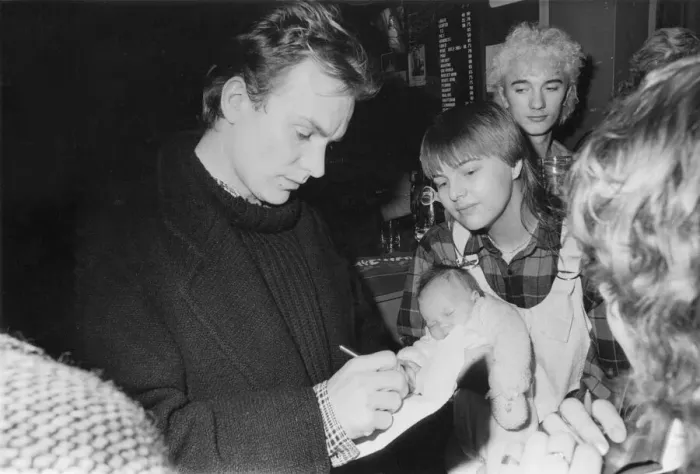 Framed Print : Sting signs his autograph for Jackie Kerr, holding her eight-week-old baby, Paula Framed Print : Sting signs his autograph for Jackie Kerr, holding her eight-week-old baby, Paula