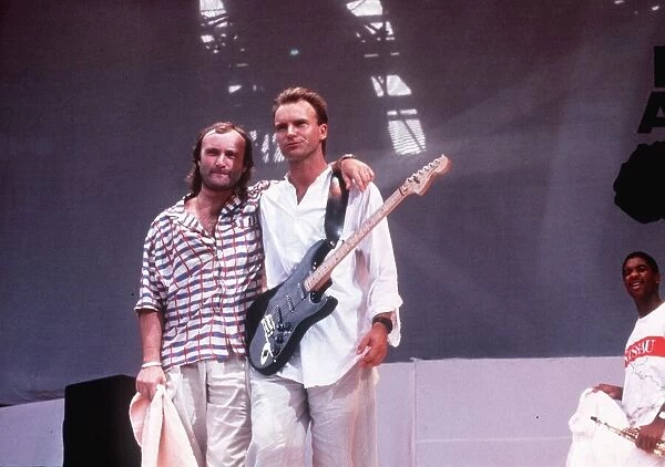 Sting singer and Phil Collins at a live aid concert at Wembley