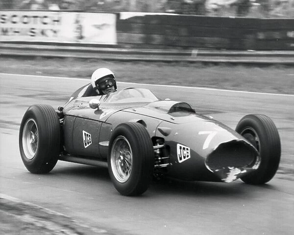 stirling moss drives a farrari dino in the historic championship rAce at oulton park june