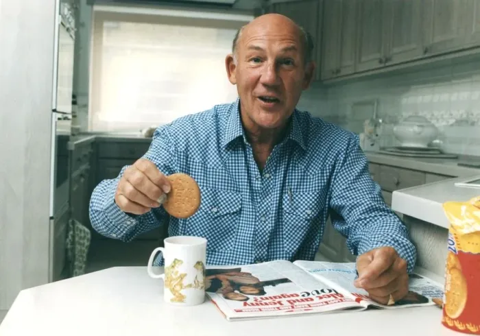 Framed Print : Stirling Moss dunkning biscuit in cup of tea reading magazine - June 1993 Framed Print : Stirling Moss dunkning biscuit in cup of tea reading magazine - June 1993