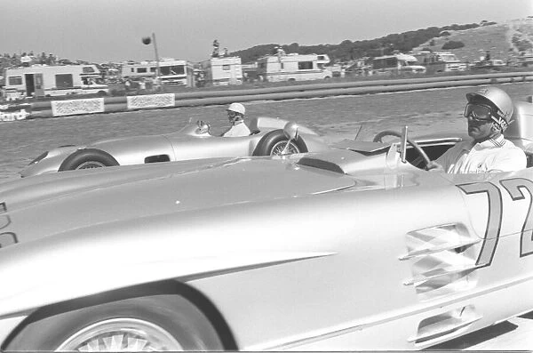 STIRLING MOSS (FOREGROUND) WITH JUAN FANGIO (BACKGROUND) - SEPT 86