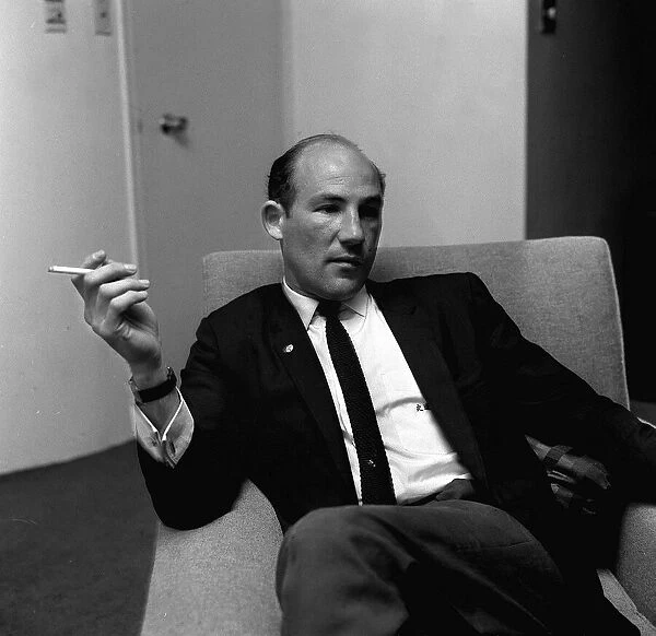 Stirling Moss in his London office May 1964