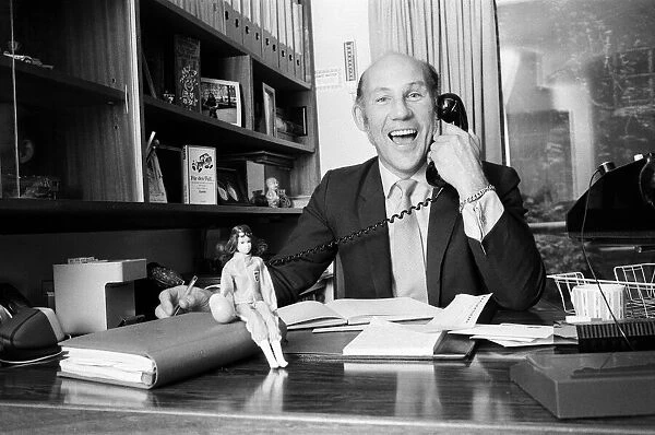 Stirling Moss pictured in his office  /  home in Shepherds Market, London. 3rd August 1973