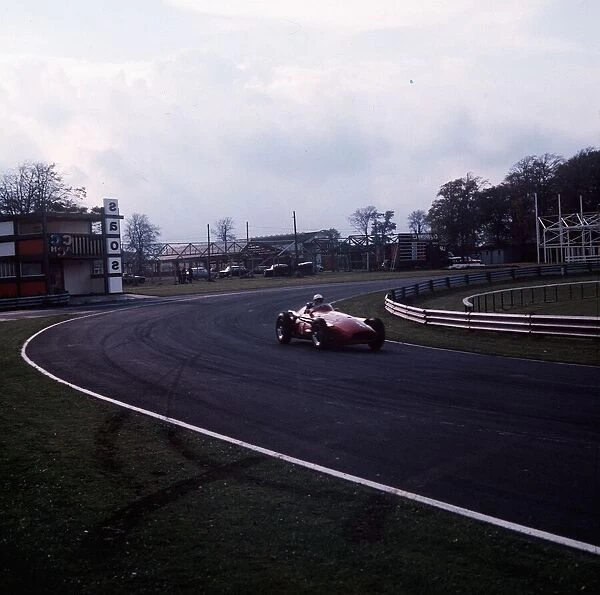 Stirling Moss on the race track going around the circuit