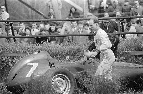 Stirling Moss retires after three laps due to brake issues