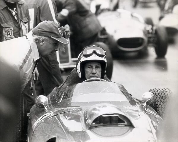 stirling moss on the starting grid at oulton park in a single seater ferrari dino about